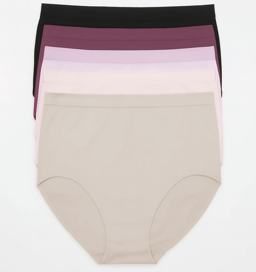 Stack of women's underwear with different color bands on a white background